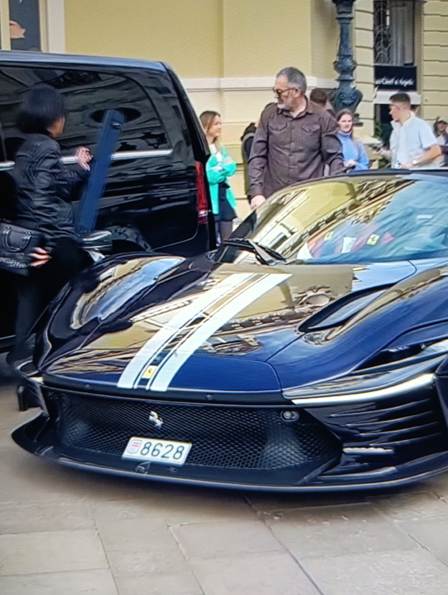 Luxury supercar gathering draws crowds in urban area