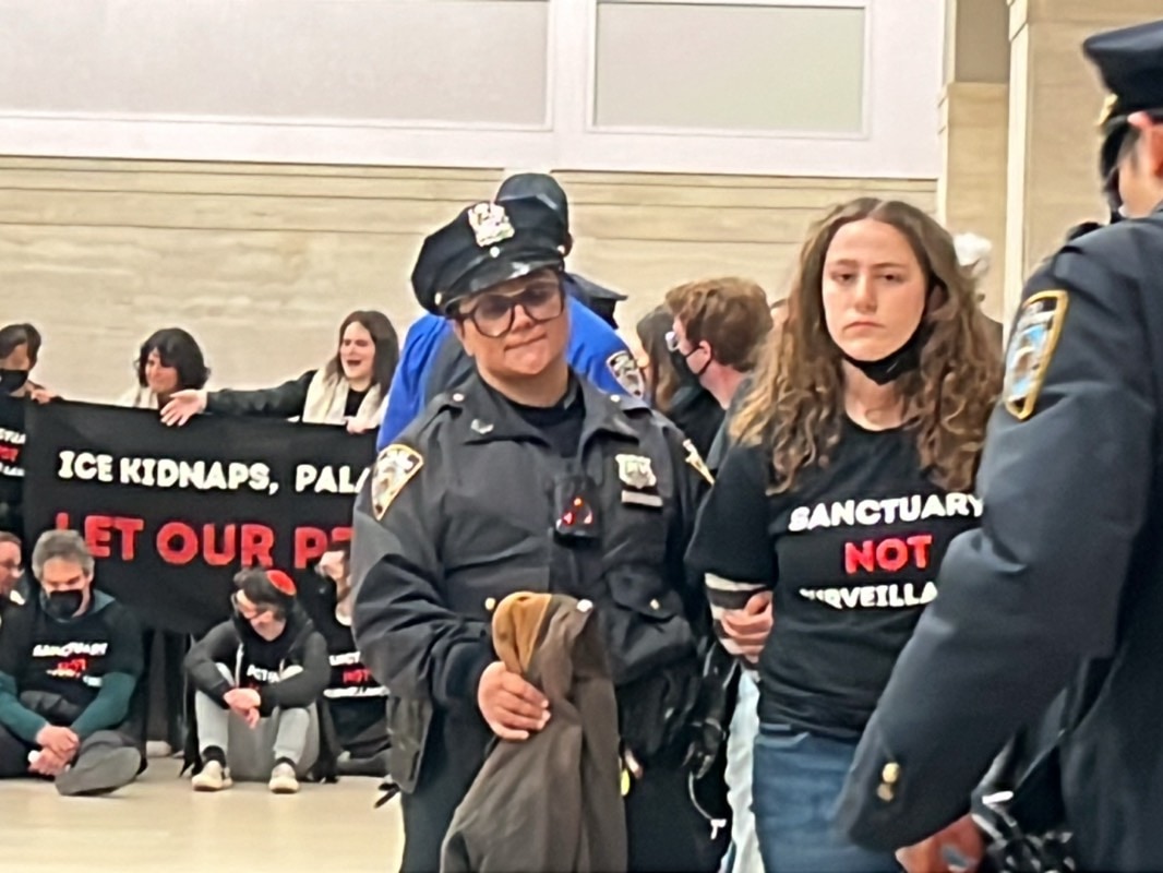 Police officer present during indoor protest at public building