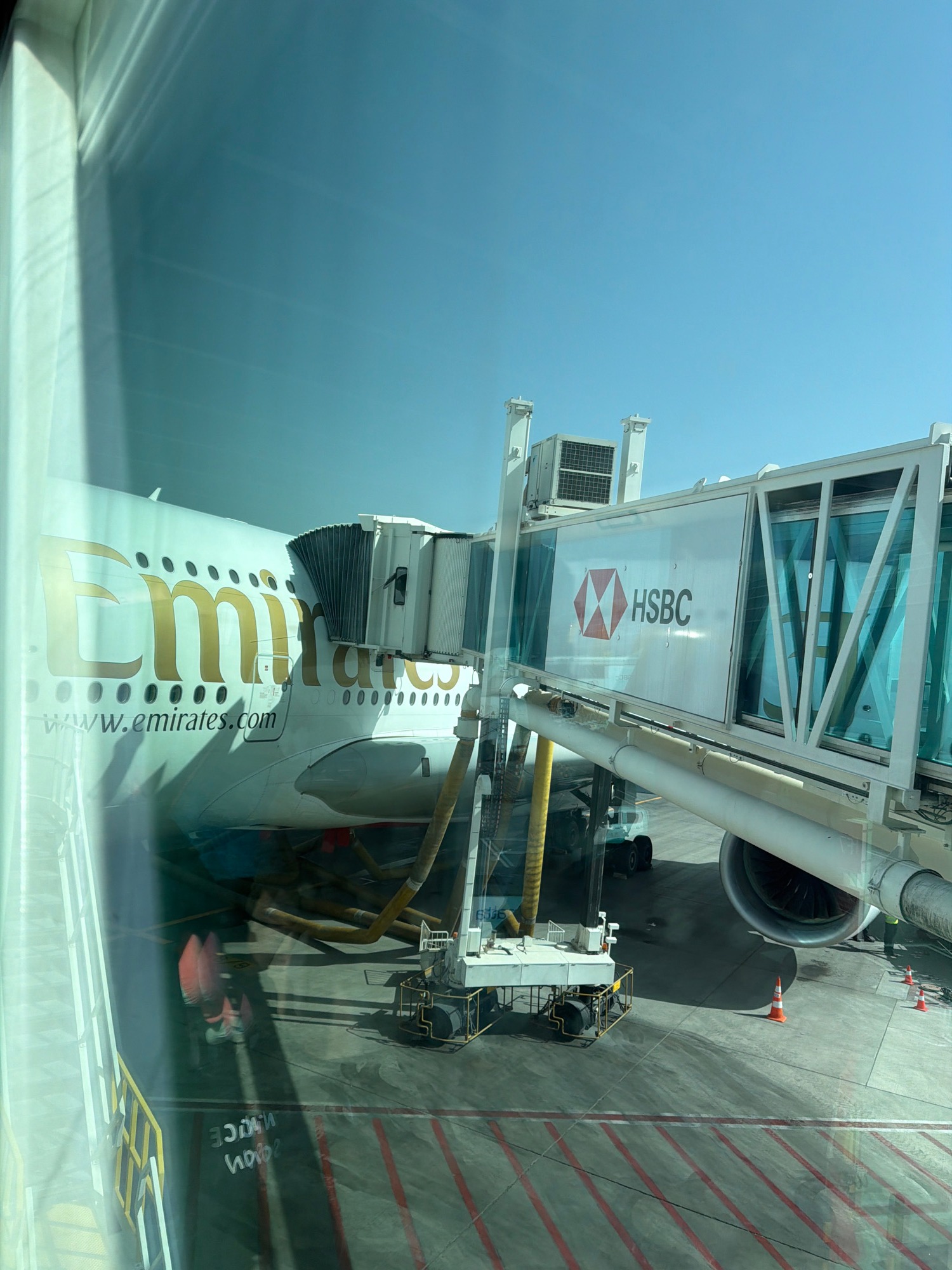 Emirates aircraft spotted at terminal gate with HSBC-branded jet bridge