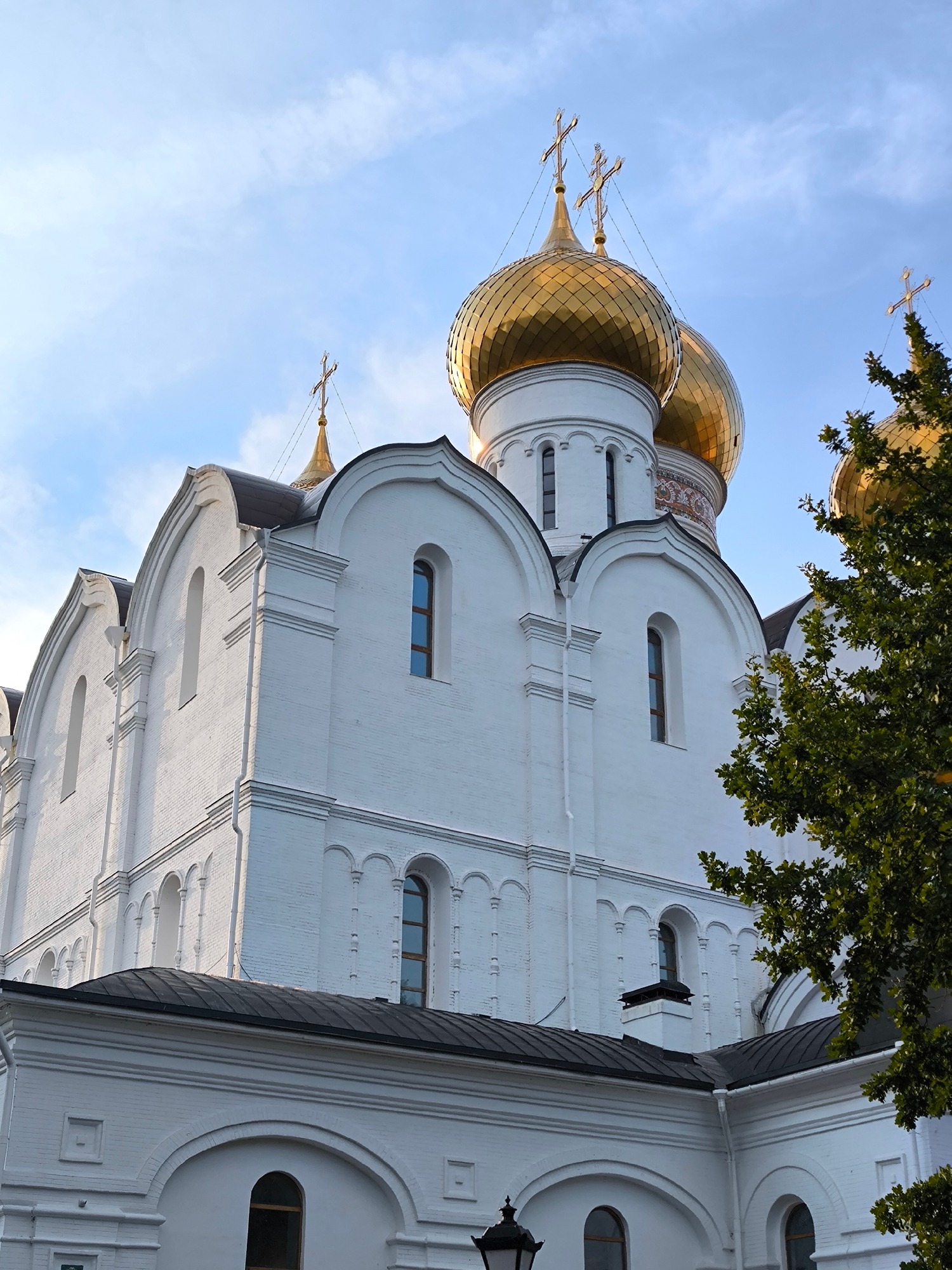 Live violin outside a golden-domed Orthodox church