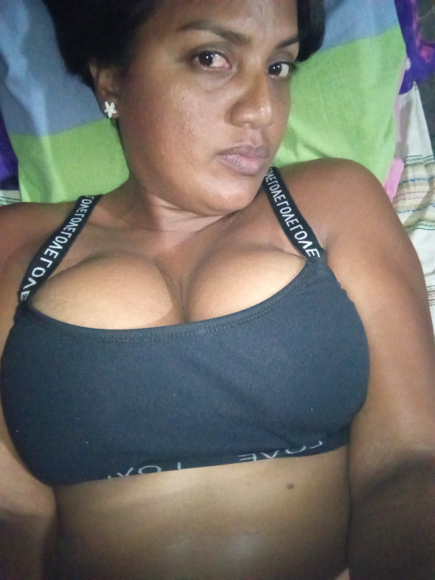Woman photographed lying in bed during early morning hours