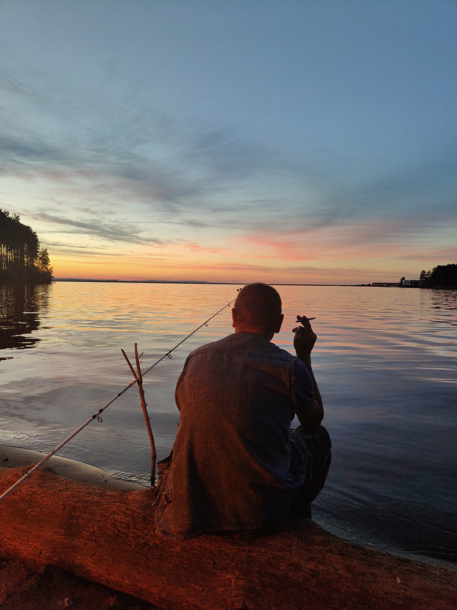 Lakeside fishing session stretches from sunset into dark