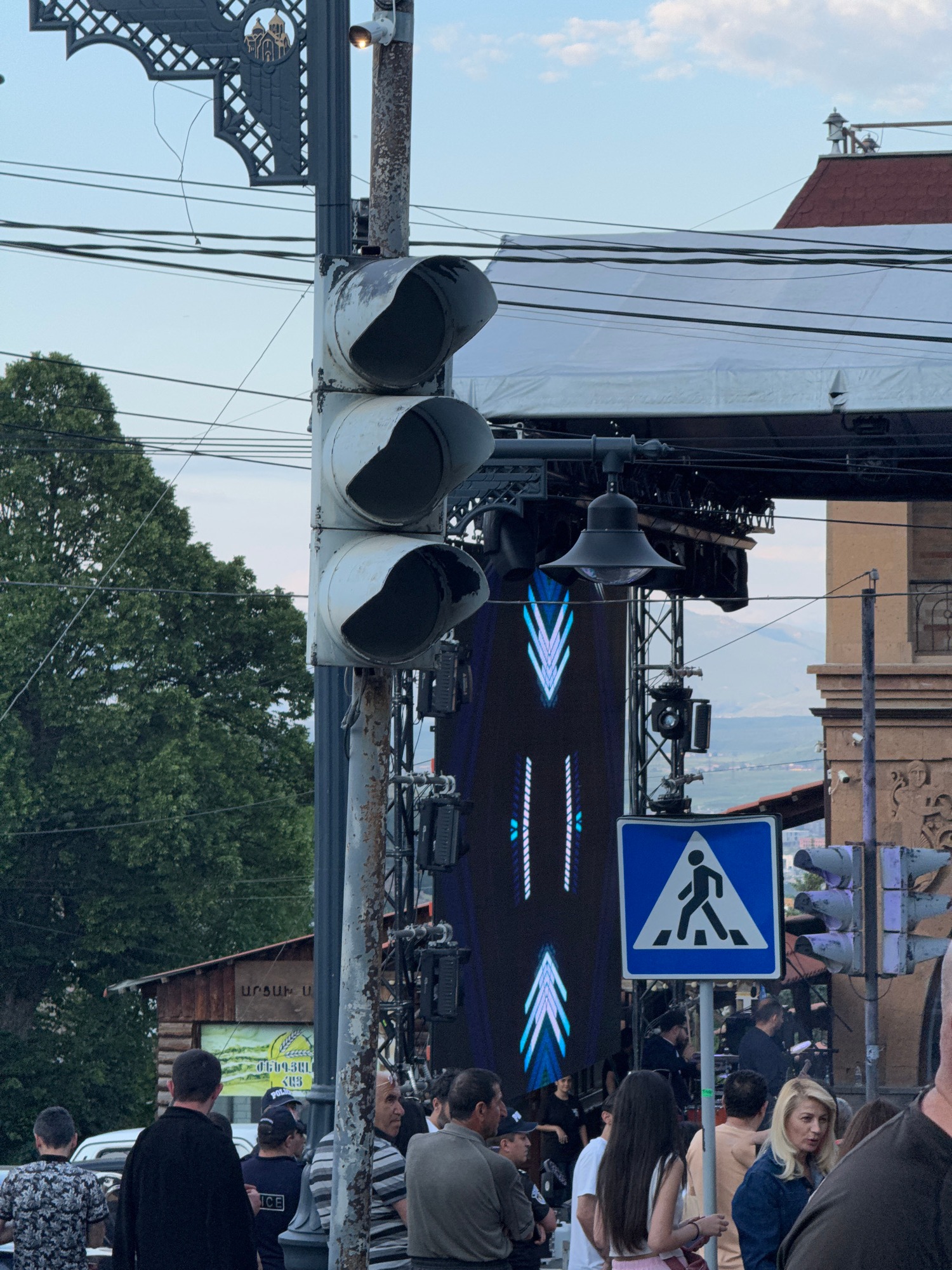 Street scenes and an outdoor DJ setup on a July afternoon