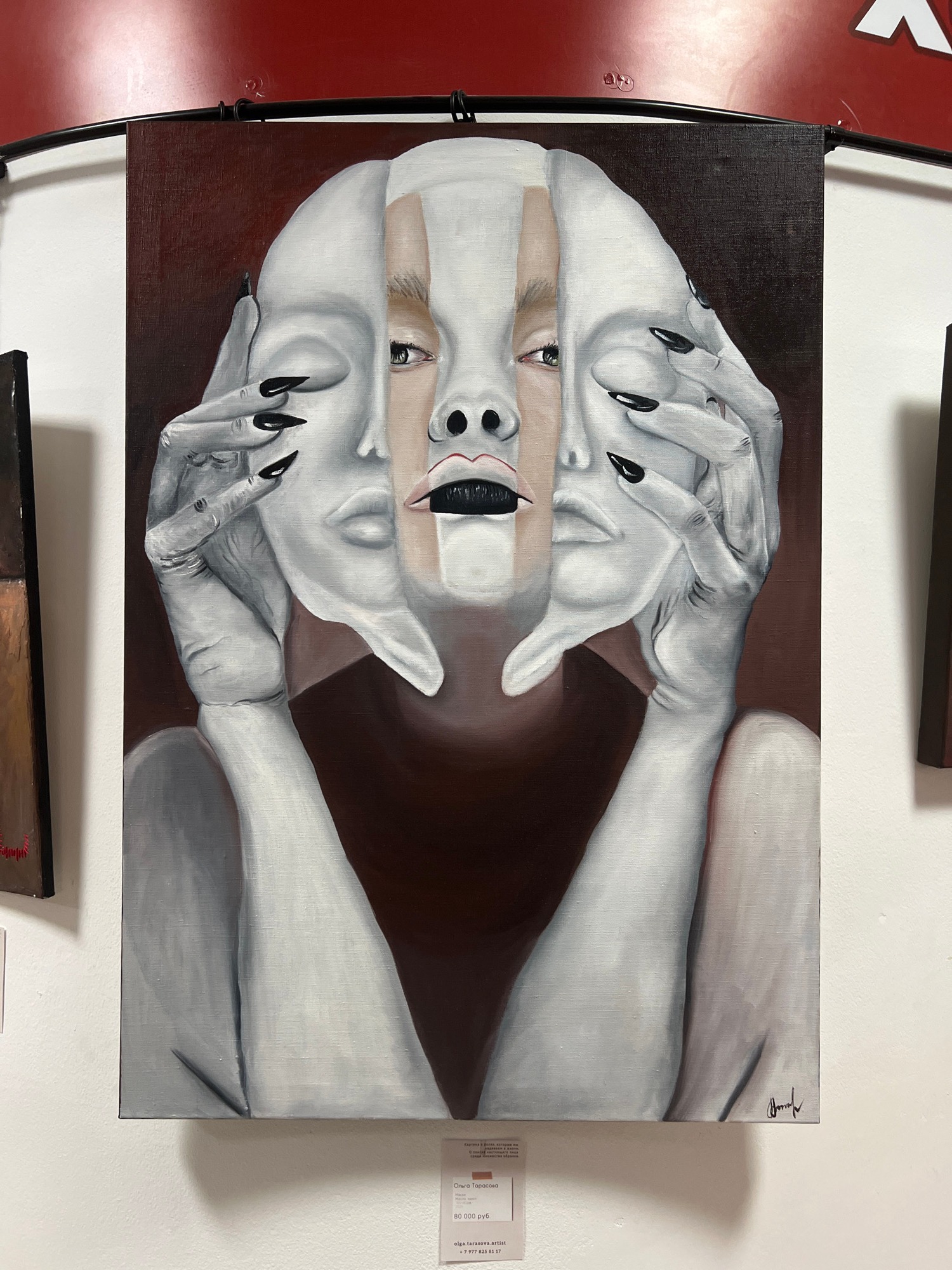 Surreal portrait painting observed in gallery exhibition setting