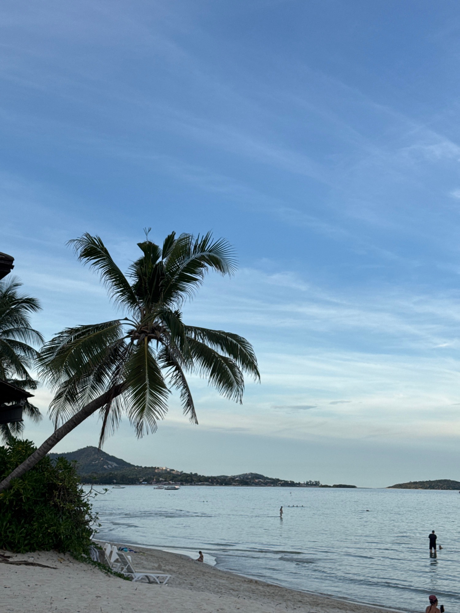 Lazy tropical beach day with shops, snacks, and ocean views