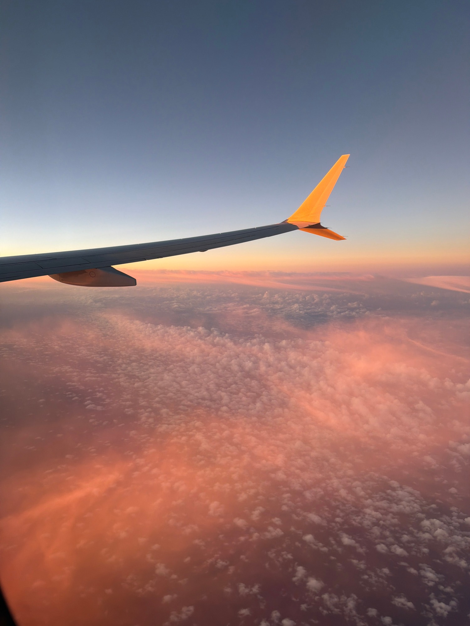Golden Hour Glide: A Journey Above the Clouds at Dawn or Dusk