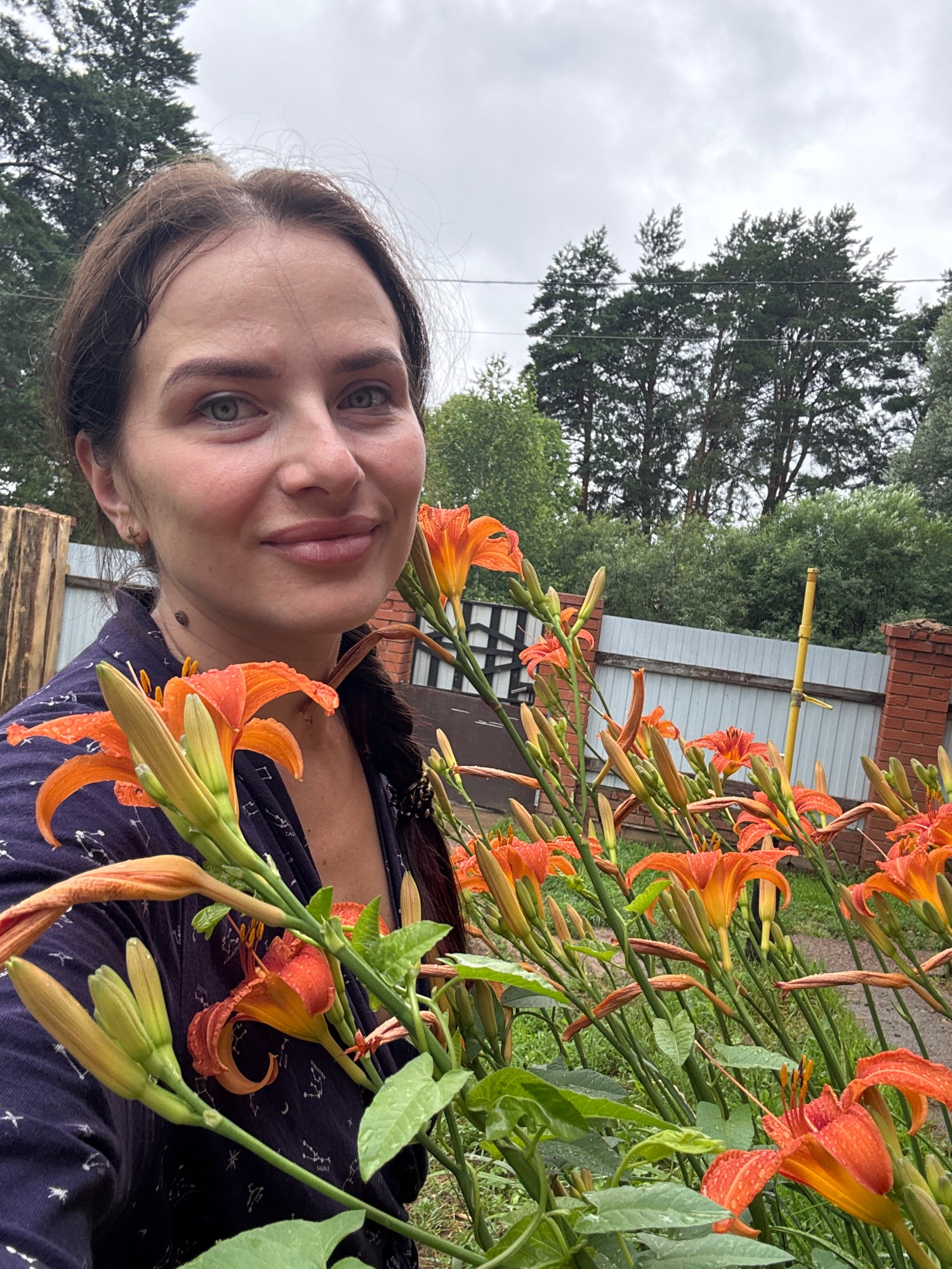 Dog on a leash, a big yawn, and orange lilies