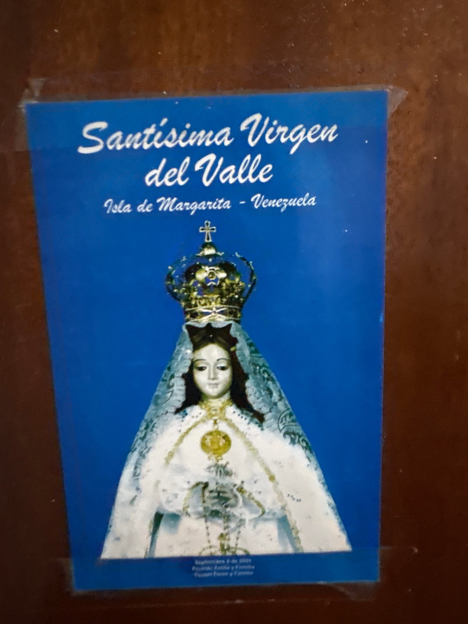 Assorted personal items — religious prints, a compass, posters — photographed up close