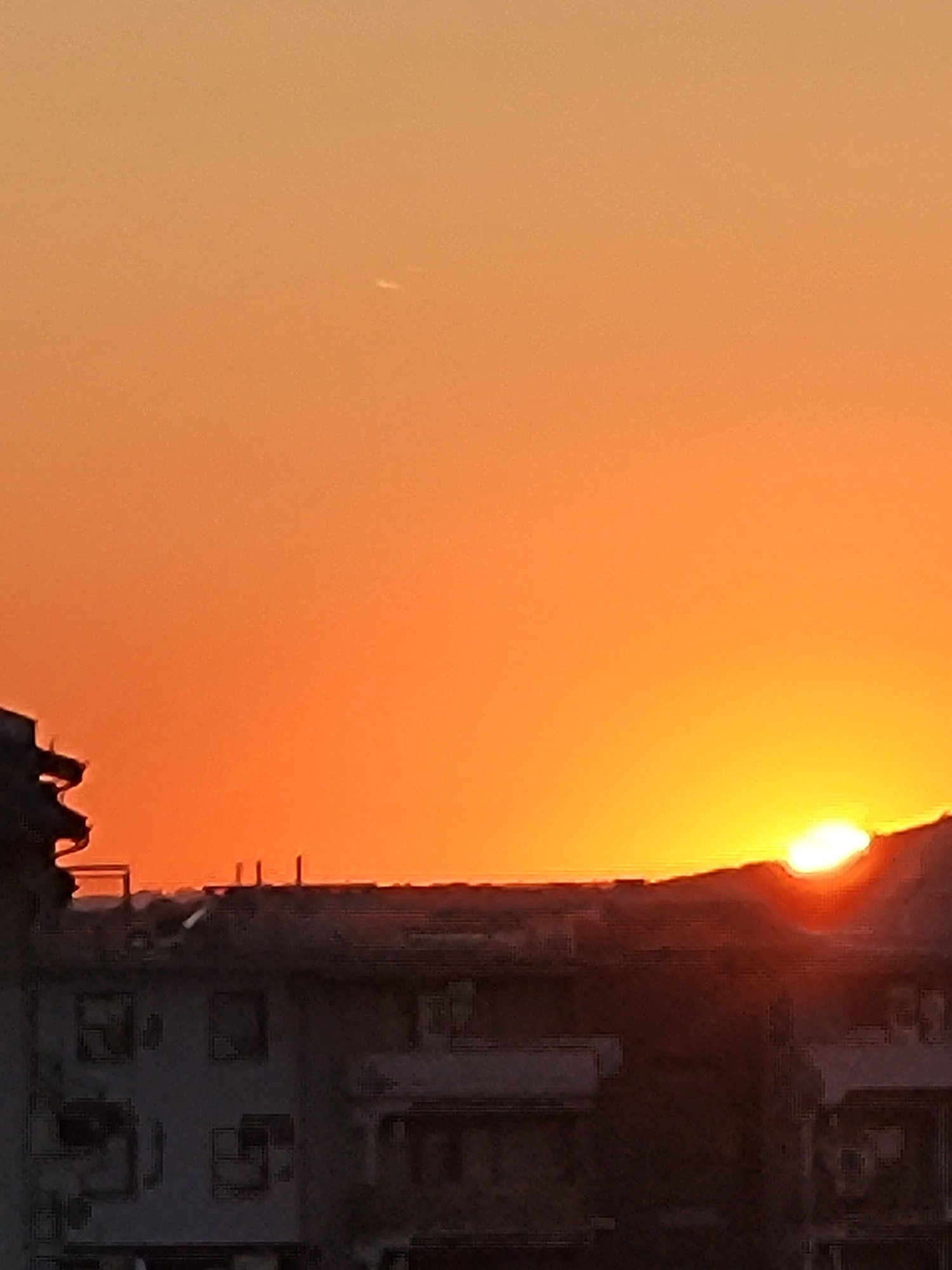 Urban sunset caught from multiple angles in quick succession