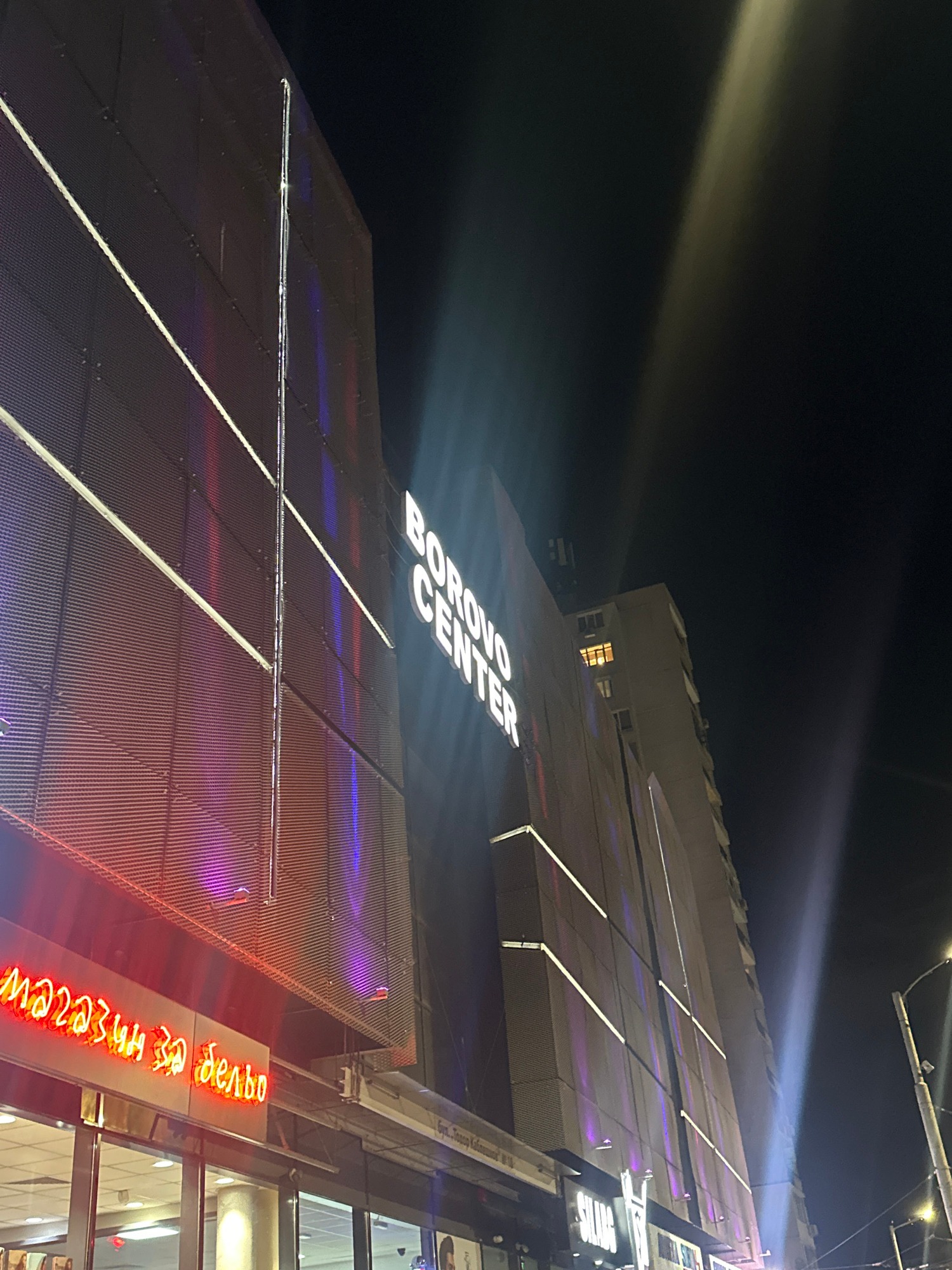 Night out around neon-lit urban streets, selfies and shawarma included