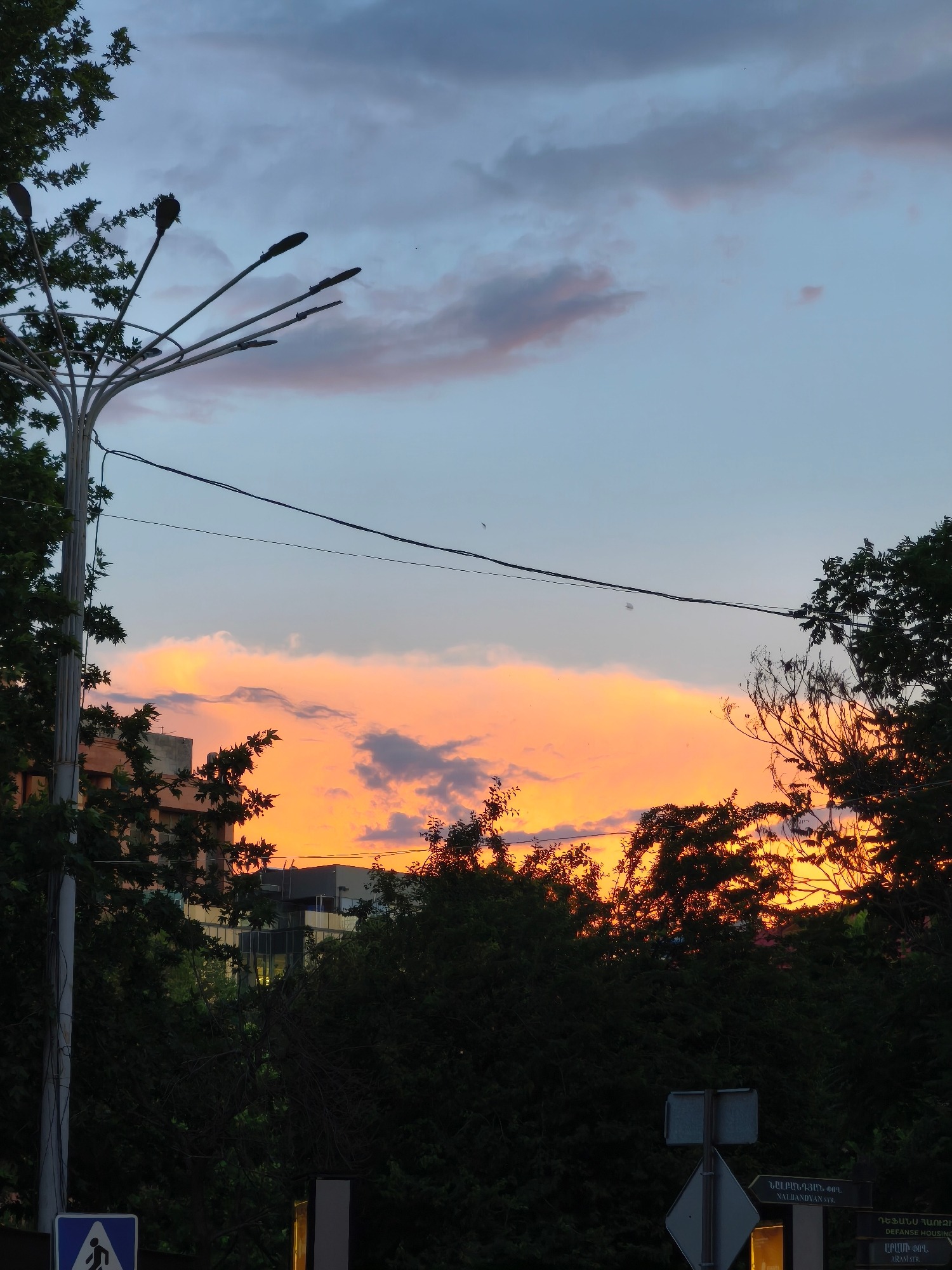 City skyline and mountain peak at golden hour