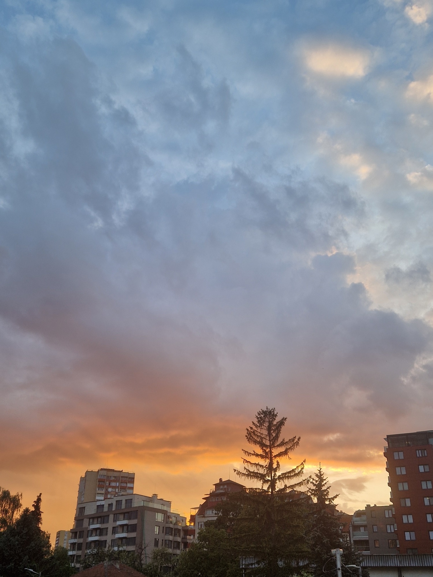 Dramatic divided sunset captured over urban construction zone