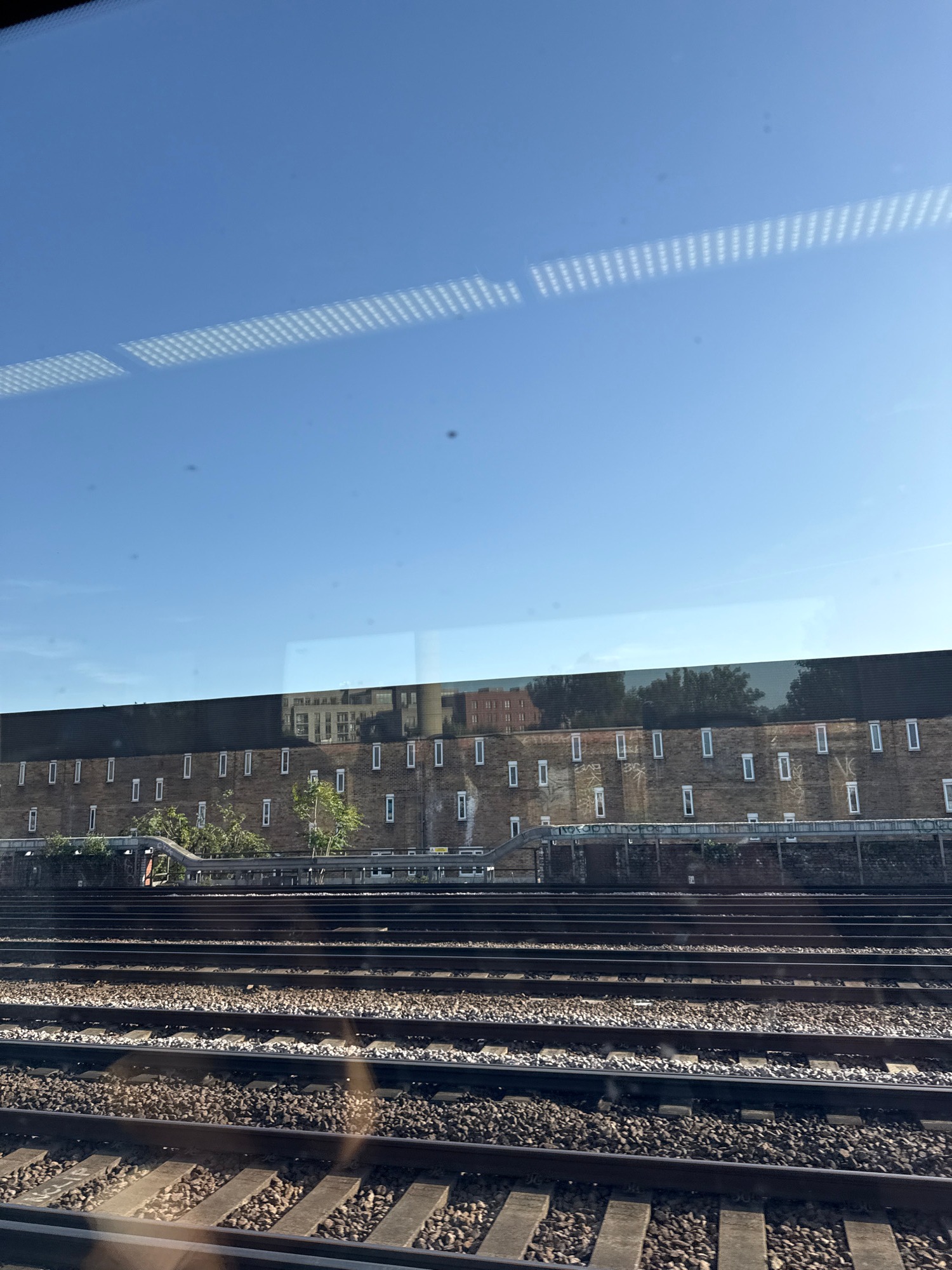 Train passenger observes passing Southeastern service and railway infrastructure