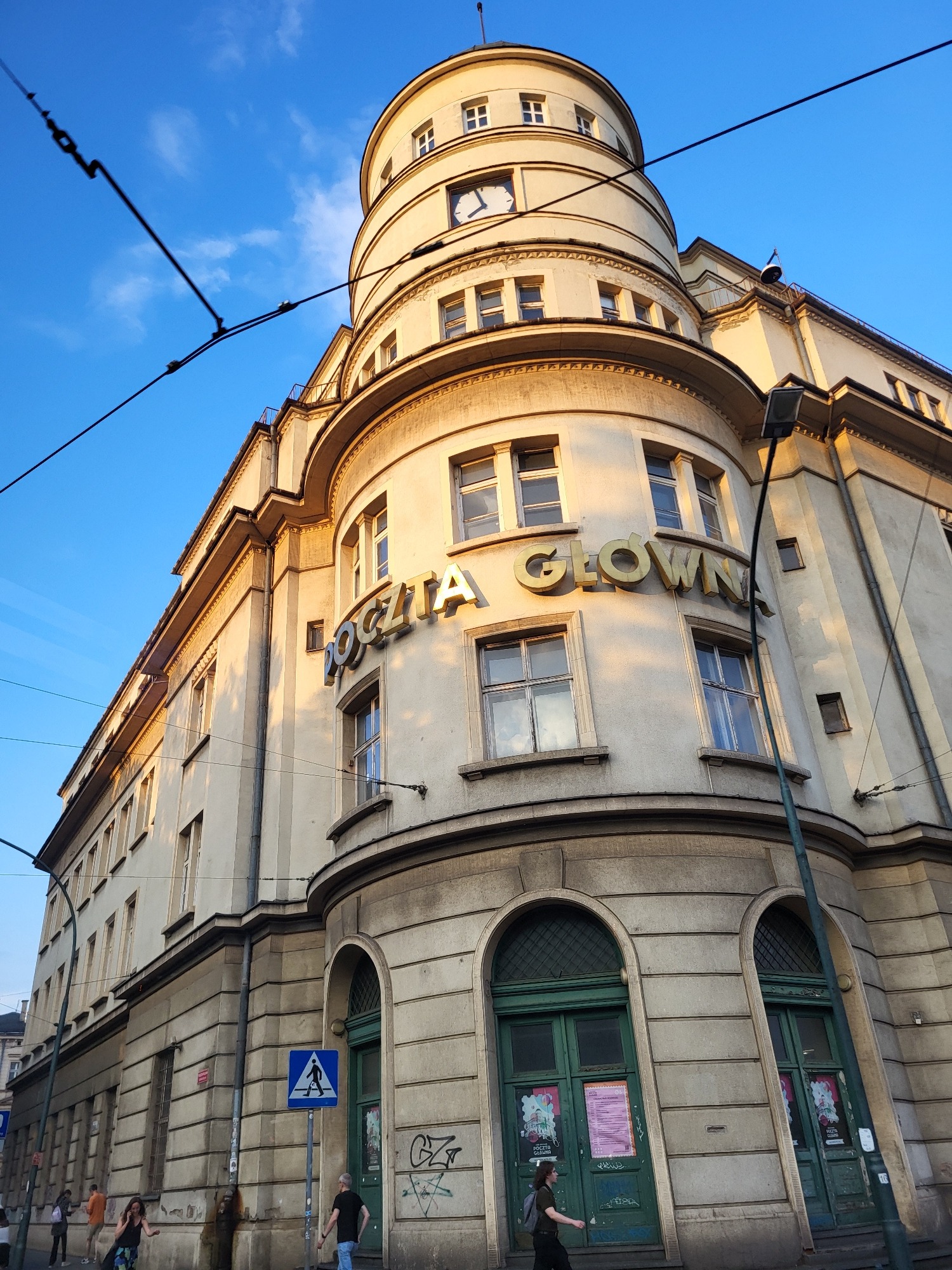 Golden-hour Warsaw streets lead into a busy shopping mall
