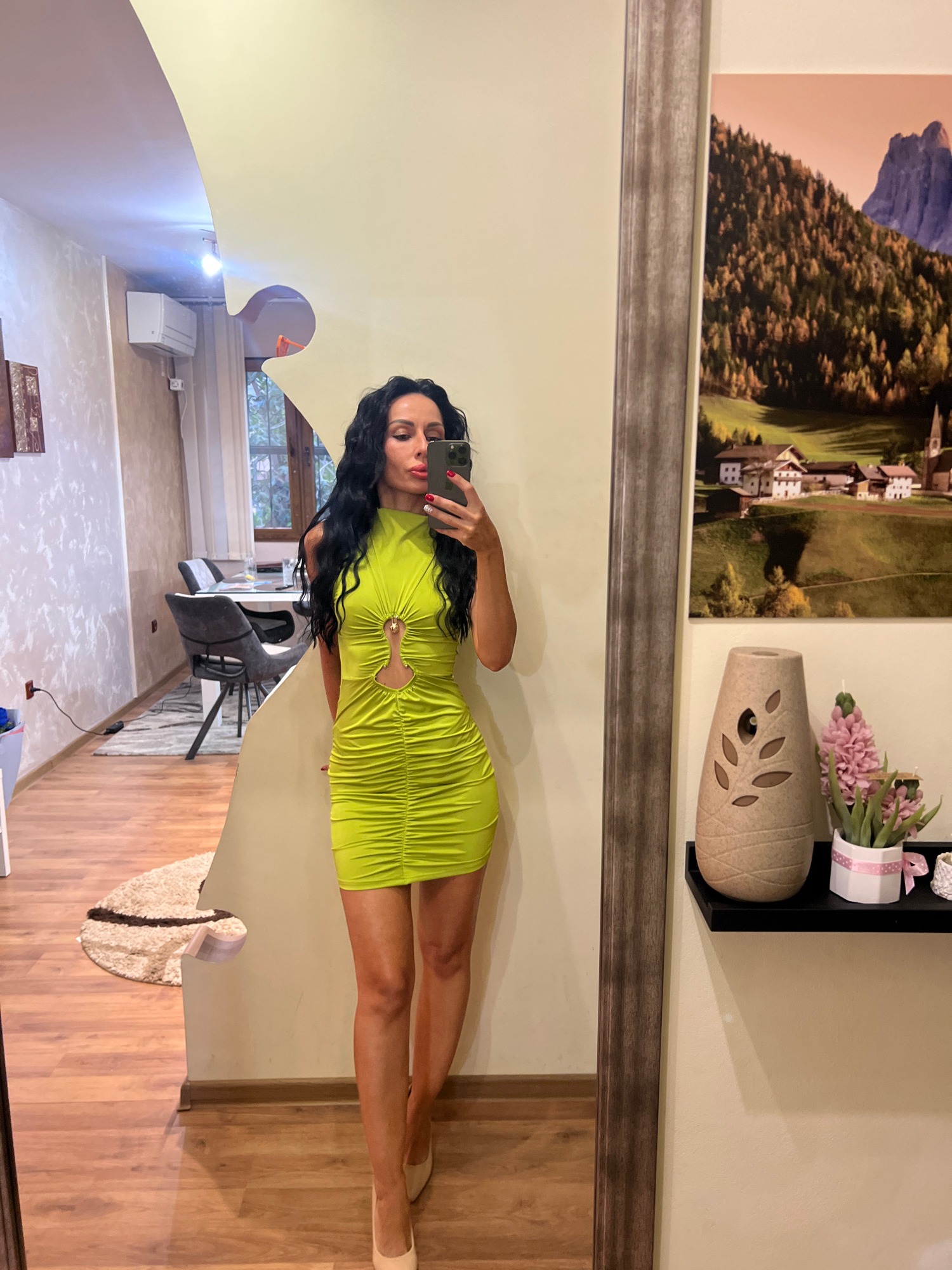 Mirror selfie in a standout lime green ruched mini-dress