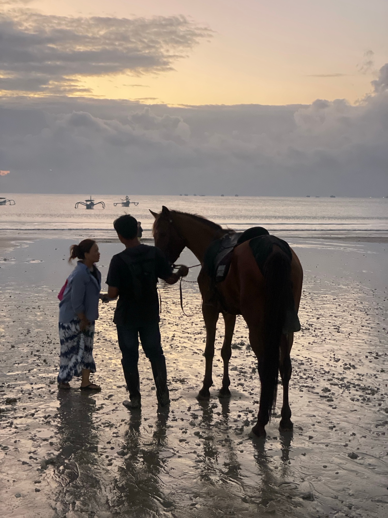 Horses, candlelit tables, and a beach at dusk