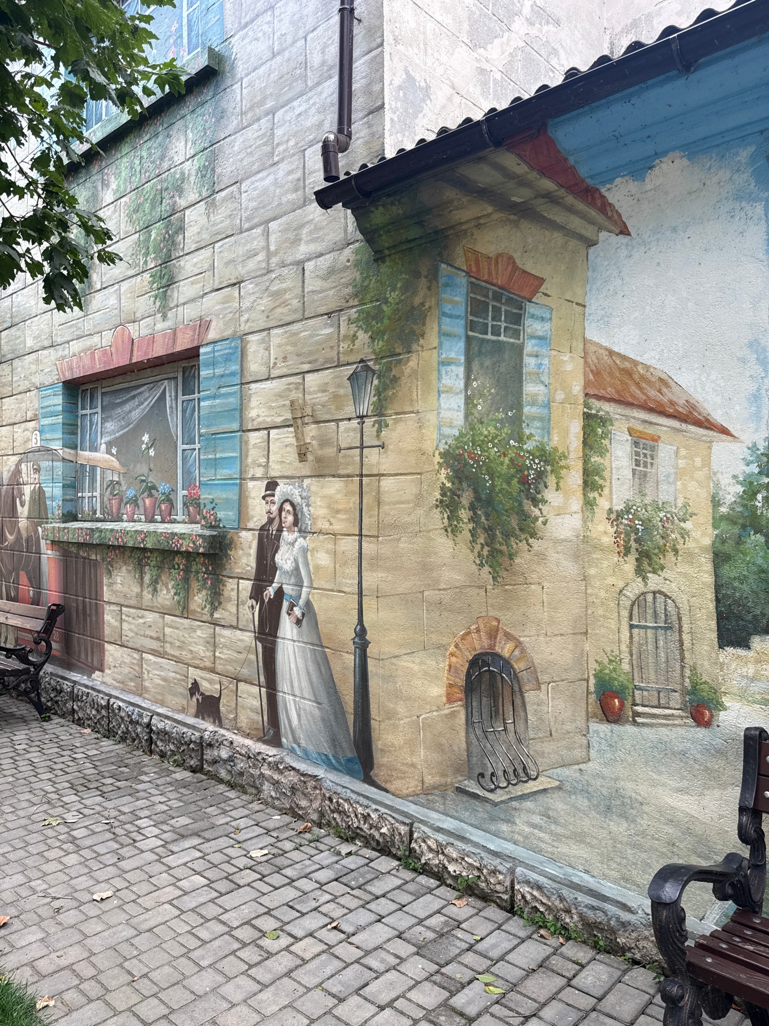 Outdoor mural trail recreating old European street and riverside scenes