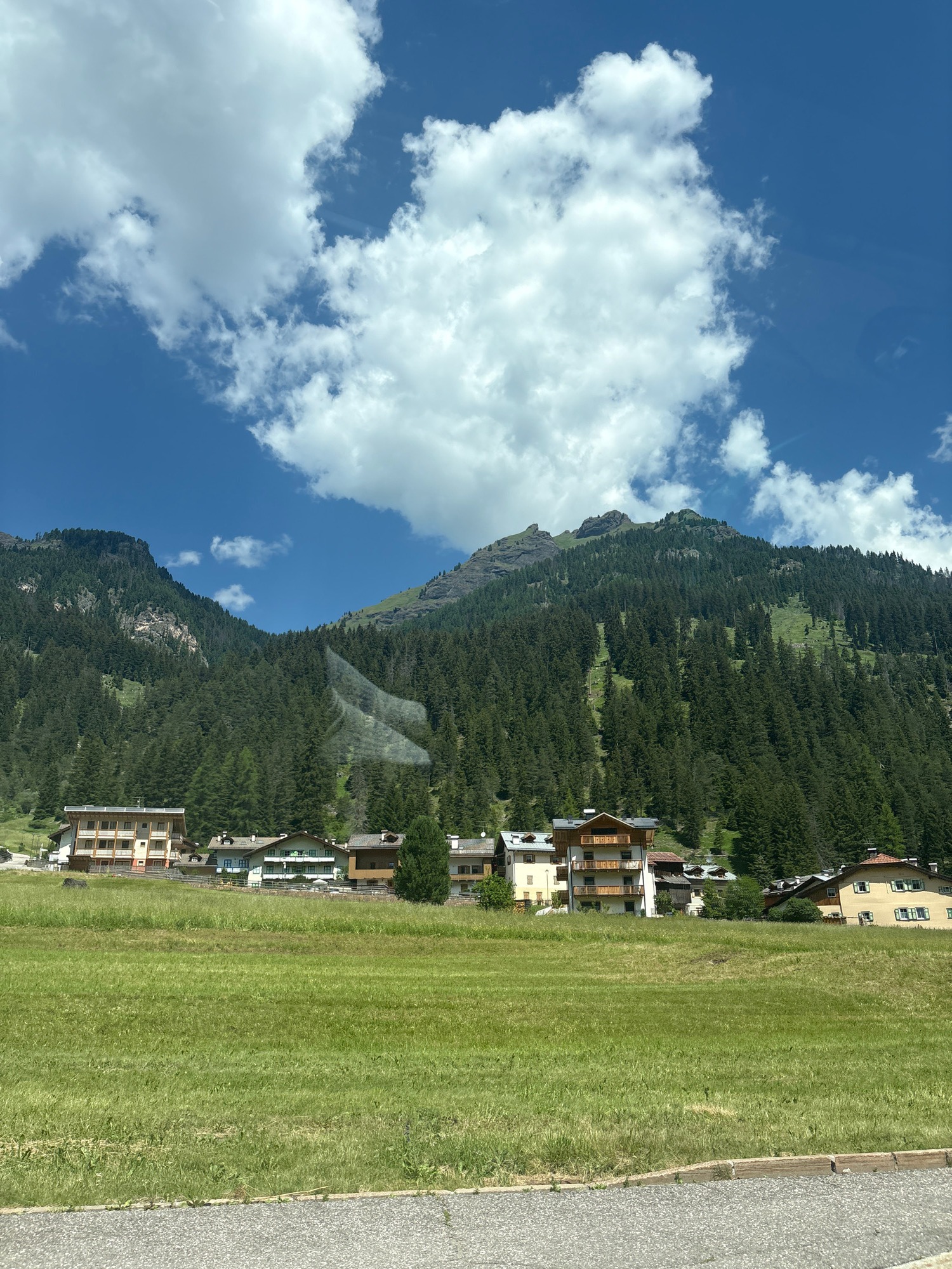 Cruising through an Alpine village on a clear summer morning