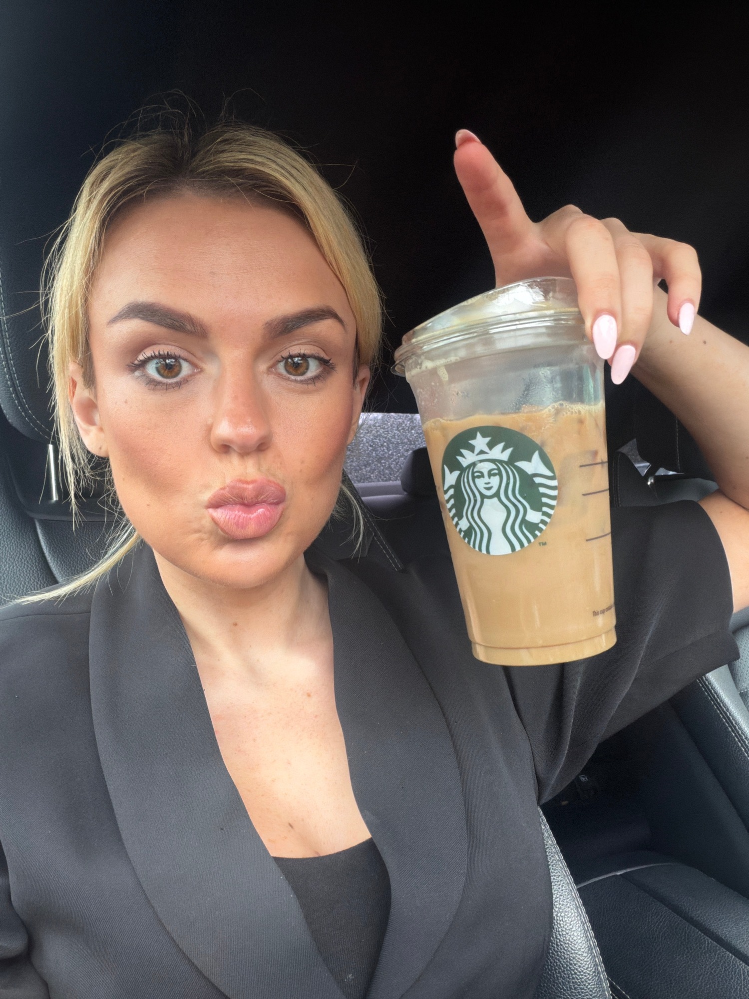 Parking lot hang, Starbucks in hand, snacks in tow