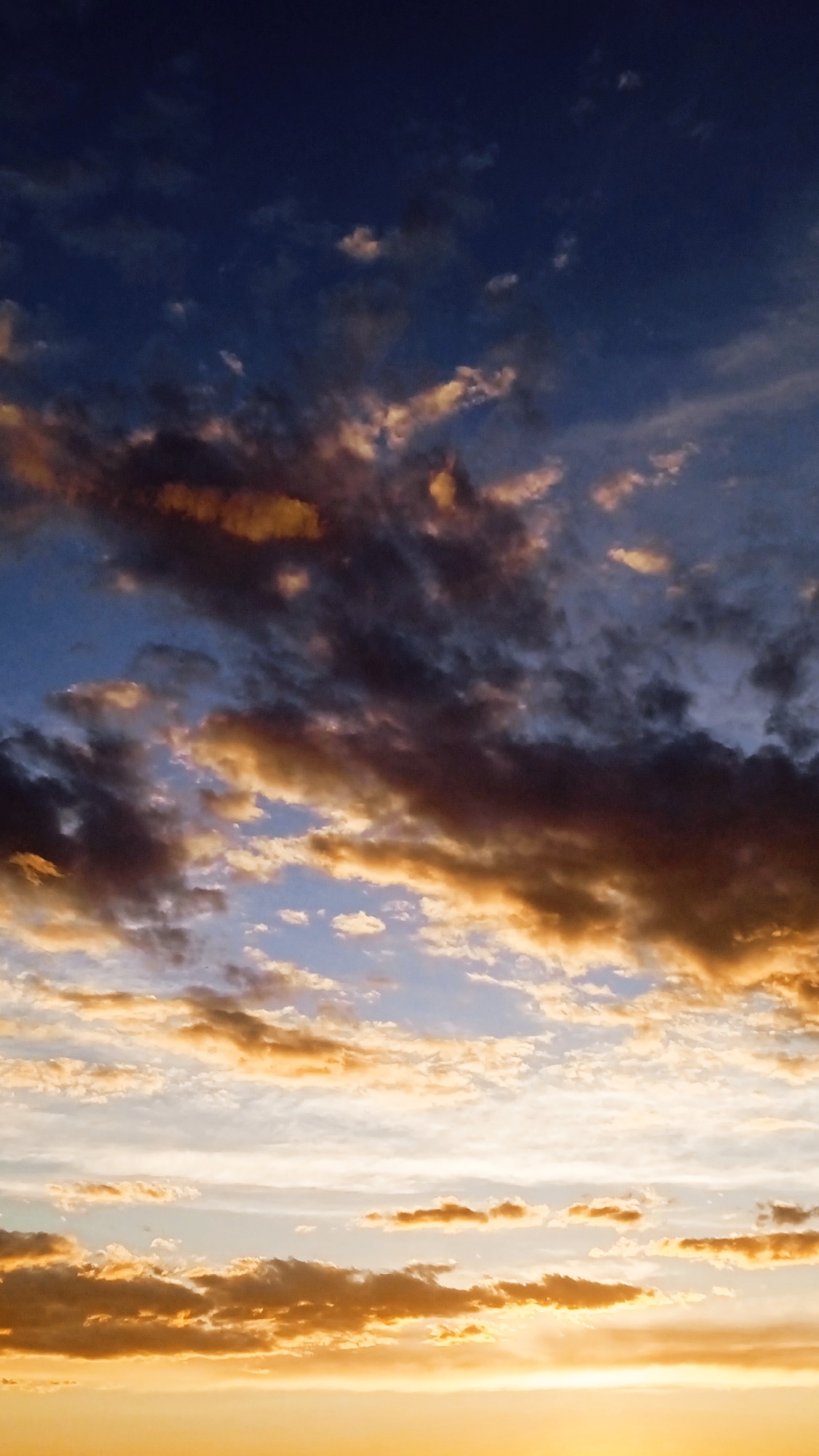 Eleven angles on a vivid sunset sky, blues fading to orange