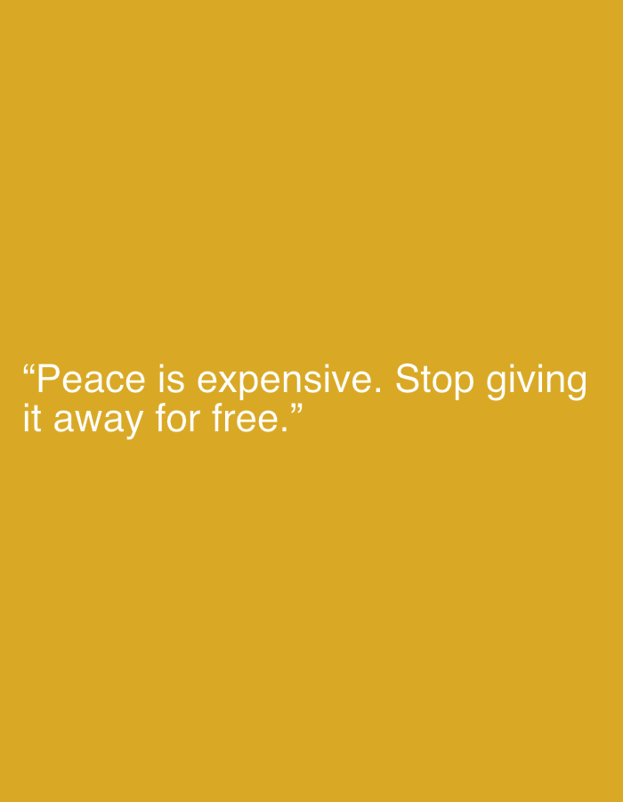 The image is a text-based graphic with a plain yellow background. White text overlays the lower portion of the image, displaying a quote. The quote reads: "Peace is expensive. Stop giving it away for free." The text is centered on the screen. There are no people, objects, or discernible environmental features present in the image beyond the background and the text itself. Therefore, it is not possible to determine or infer any location, including in the city of Jalingo, Nigeria.