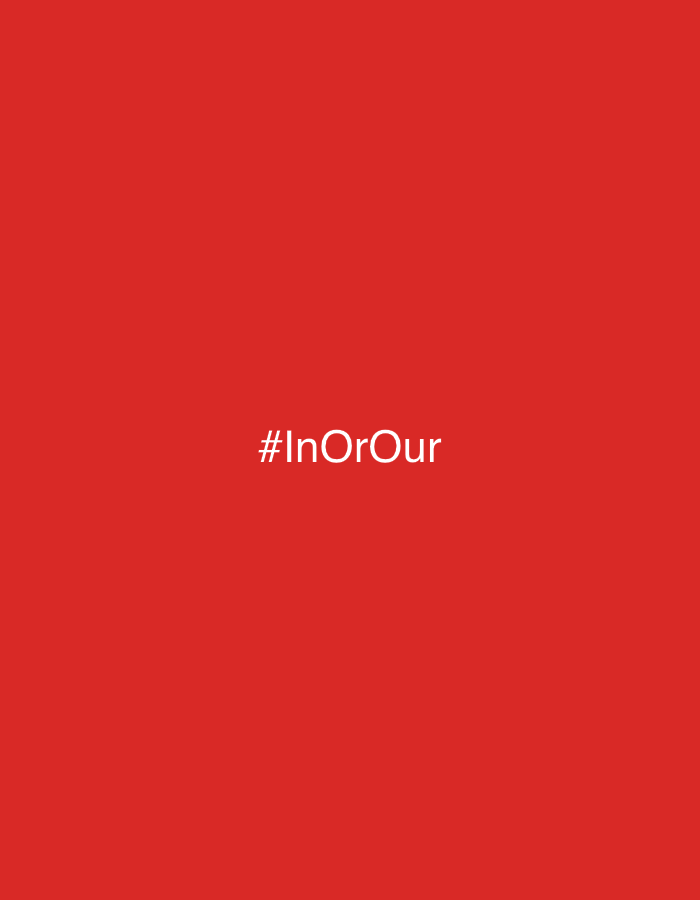 The image is a solid red background with the white text "#InOrOur" centered in the middle. There are no other discernible objects, people, or environmental features present in the image. The location in the city of Parchim, Germany, is not indicated or derivable from the visual information provided.