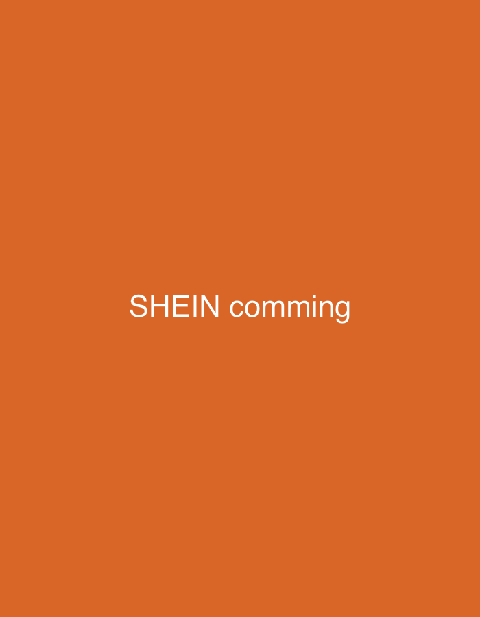 The image shows a plain orange background with white text centered in the middle. The text reads "SHEIN comming". There are no other objects or discernible features in the image.