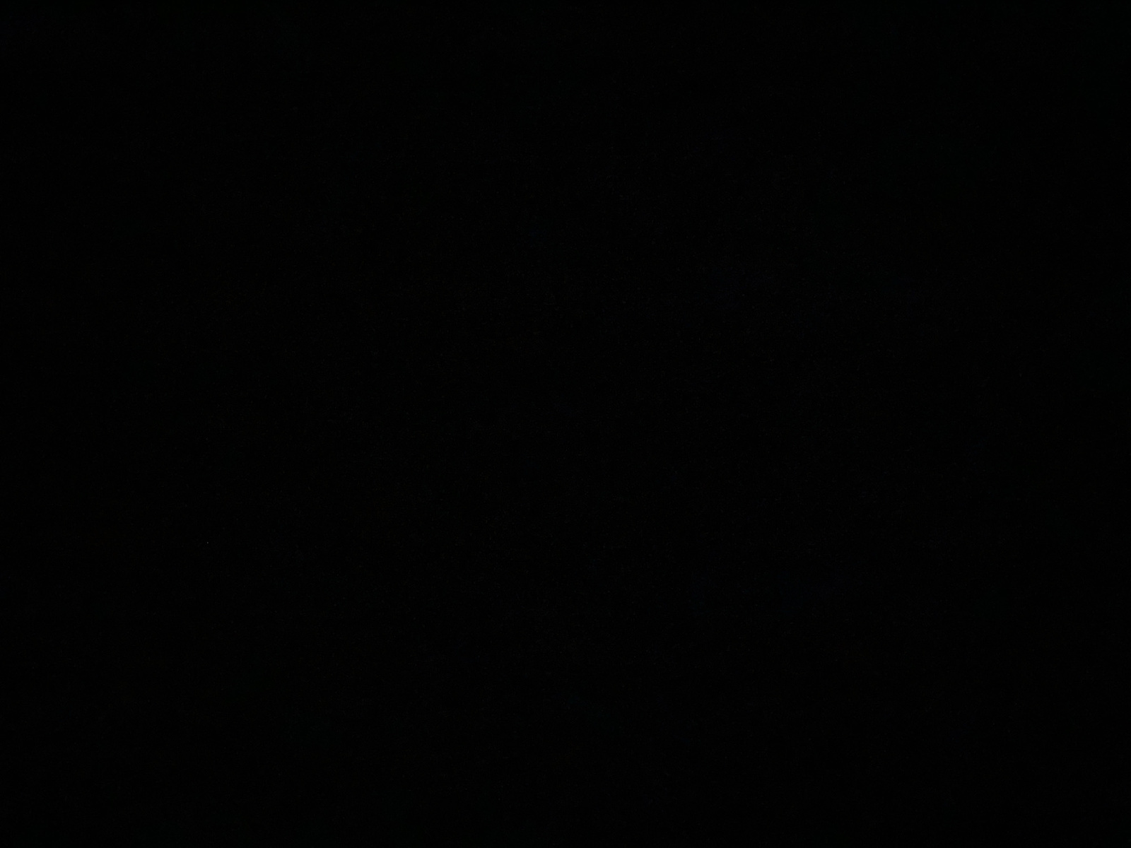 The image is a solid black rectangle. There are no discernible objects, people, actions, or environmental details visible. Therefore, it is not possible to determine its location in Jalingo, Nigeria, or provide any further description.