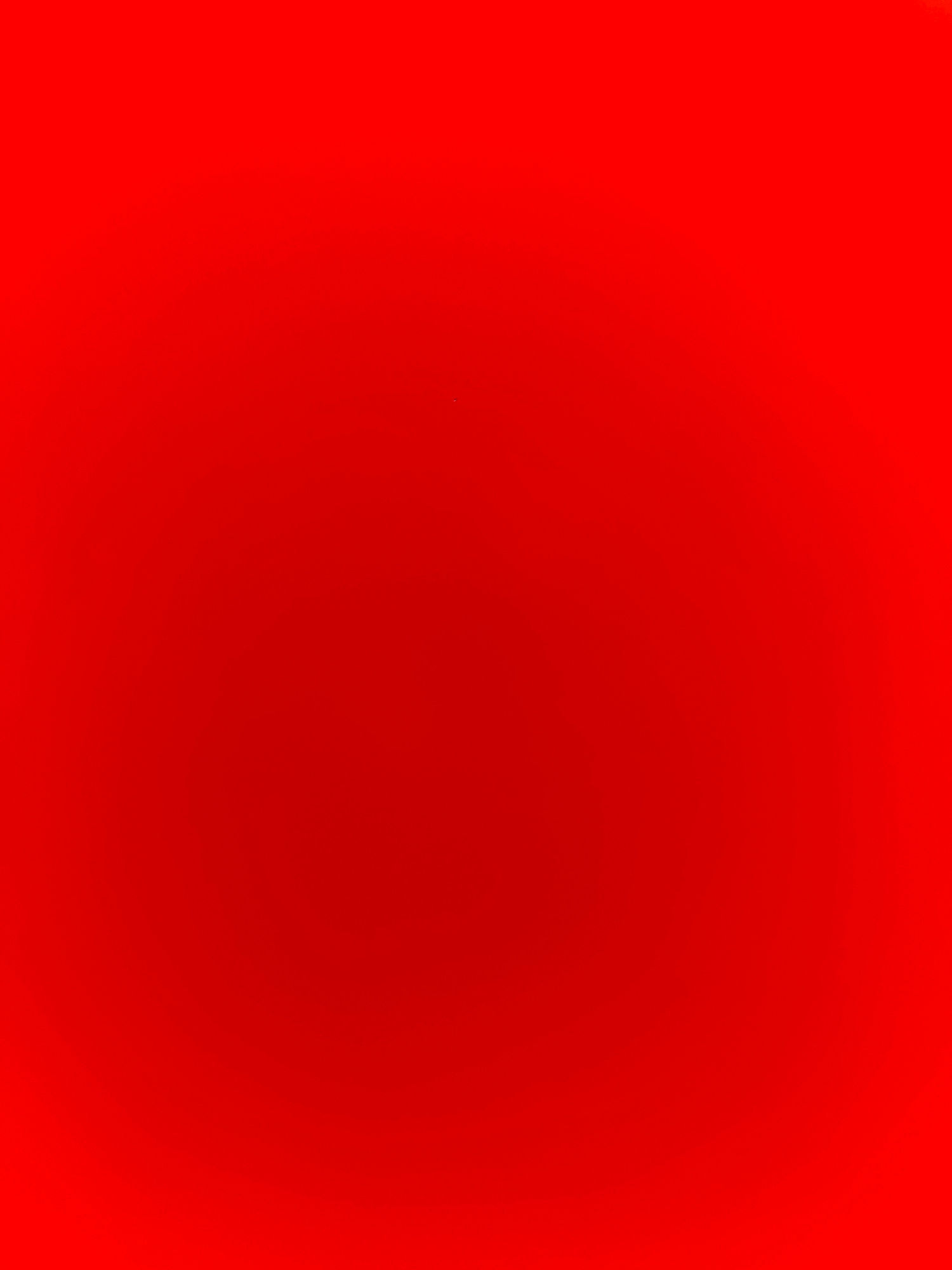 The image is a solid red background with no discernible objects, people, actions, interactions, or environment. Therefore, it cannot be described in detail or located in Ratsada, Thailand.