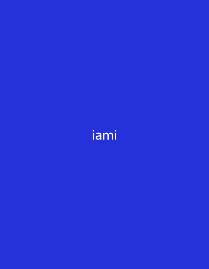 The image is a vertical, full-frame shot of a plain, solid royal blue background. Centered within the frame, slightly above the midpoint, is the word "iami" rendered in white, sans-serif text. There are no other discernible objects, people, or environmental features. The lighting appears even and shadowless.