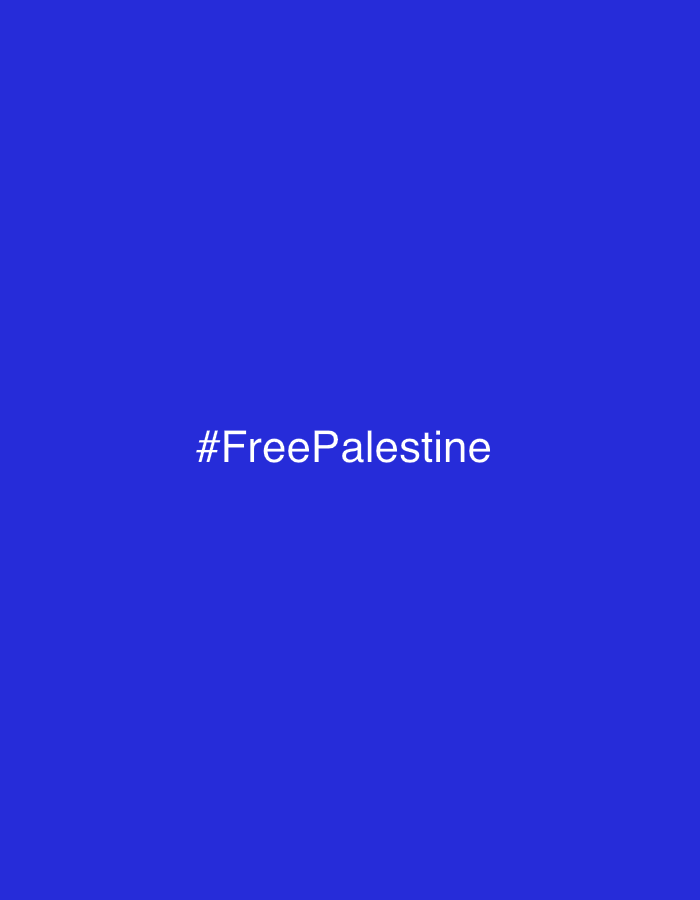 The image is a solid, vibrant blue background with the white hashtag "#FreePalestine" centered horizontally and vertically. There are no discernible landmarks or environmental features indicating a specific location within Naberezhnye Chelny, Russia or any other city. The image solely consists of the text against a uniform color.