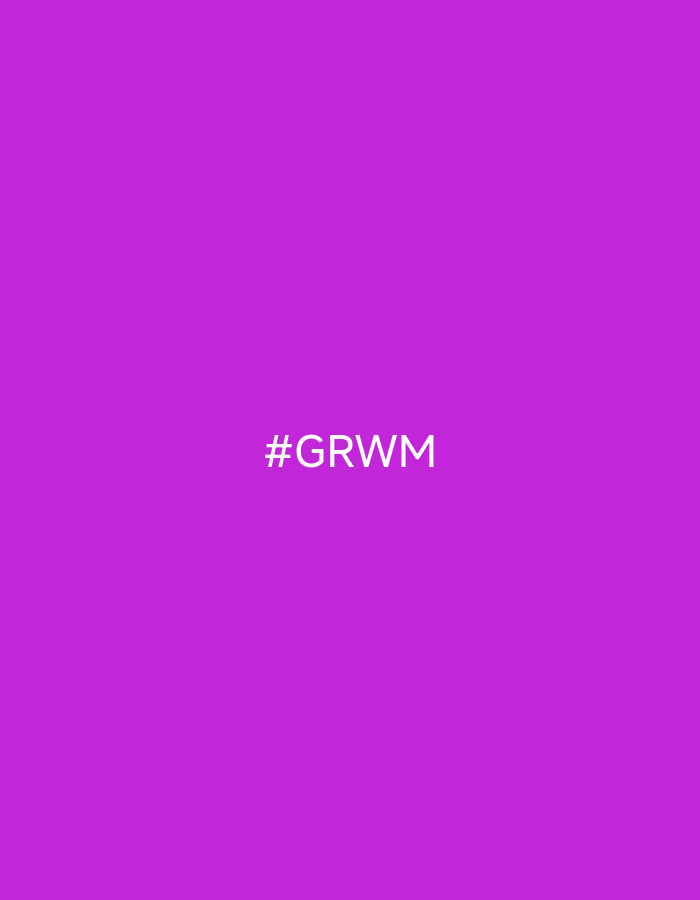 The image is a solid, vibrant purple background with white text centered on it that reads "#GRWM". There are no other objects, people, or environmental details present in the image. The location is unknown.