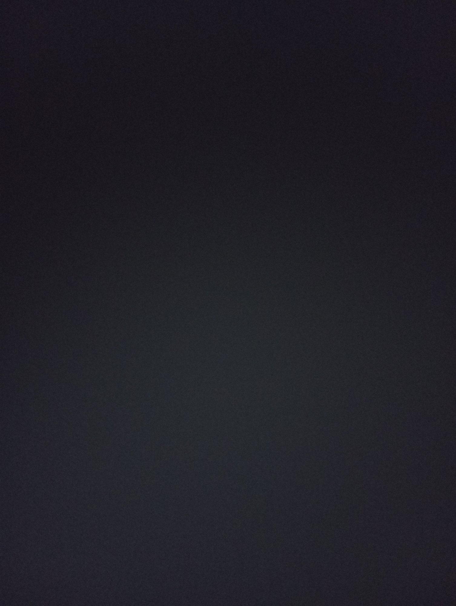 The image is a dark, grainy, solid black background. There is no discernible content, person, object, action, interaction, or environmental detail visible in the image. Therefore, it is impossible to provide any location information or a description of a scene within the city of Ак-Жар, Kyrgyzstan.