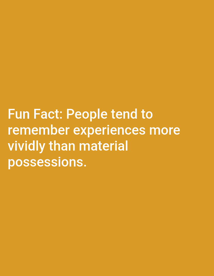 The image displays white text on a plain orange background. The text reads: "Fun Fact: People tend to remember experiences more vividly than material possessions." There are no people, objects, or discernible environmental features present in the image. The location of Lagos, Nigeria, is not depicted or implied in any way by the visual content.