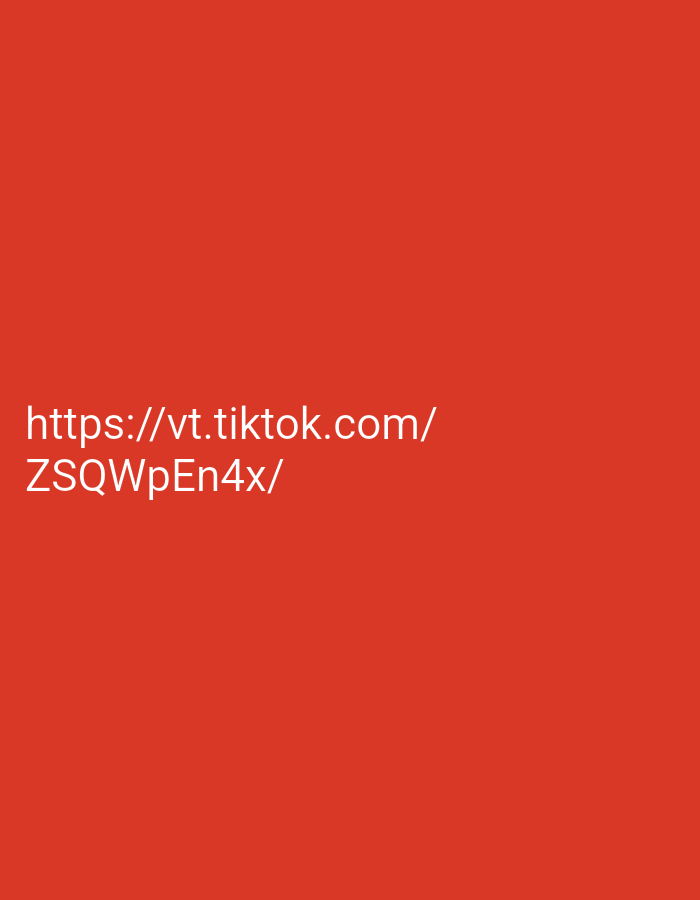 The image displays a plain, bright red background with white text. The text reads "https://vt.tiktok.com/" on the first line and "ZSQWpEn4x/" on the second line. There are no other discernible elements in the image, such as people, objects, or any indication of a location in Jos, Nigeria. The image is a simple text overlay on a solid color.