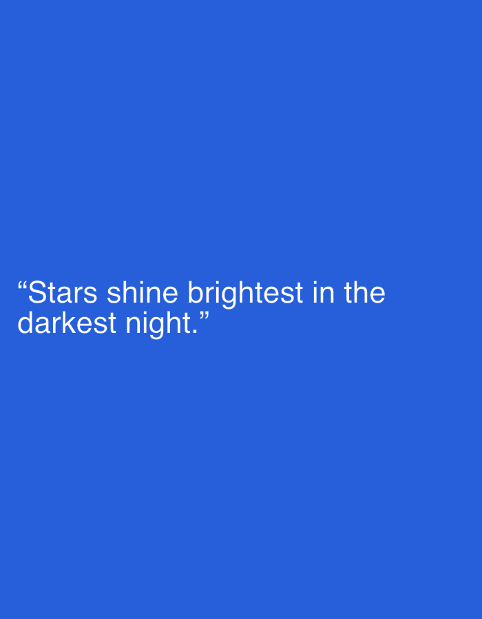 The image is a digital graphic with a solid blue background. Overlayed on the background in white text is the quote, "Stars shine brightest in the darkest night." The text is positioned in the lower-left quadrant of the image. There are no people, objects, actions, interactions, or environmental elements visible in the image other than the text and background. The location in Kołobrzeg, Poland is not depicted in the image.