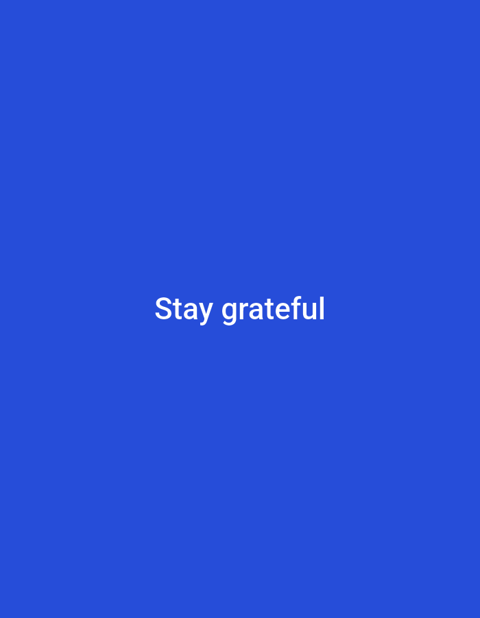The image is a digital graphic with a solid royal blue background. Centered on the graphic are the words "Stay grateful" written in white, sans-serif font. There are no people, objects, or environmental features visible in the image. Therefore, it is not possible to provide any details about its location in Safi, Morocco.