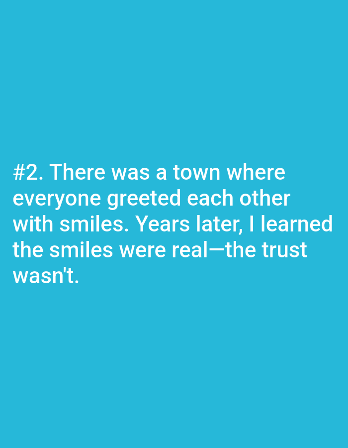 A close-up, eye-level, medium shot shows white text against a solid bright blue background. The text is centered and reads "#2. There was a town where everyone greeted each other with smiles. Years later, I learned the smiles were real—the trust wasn't."