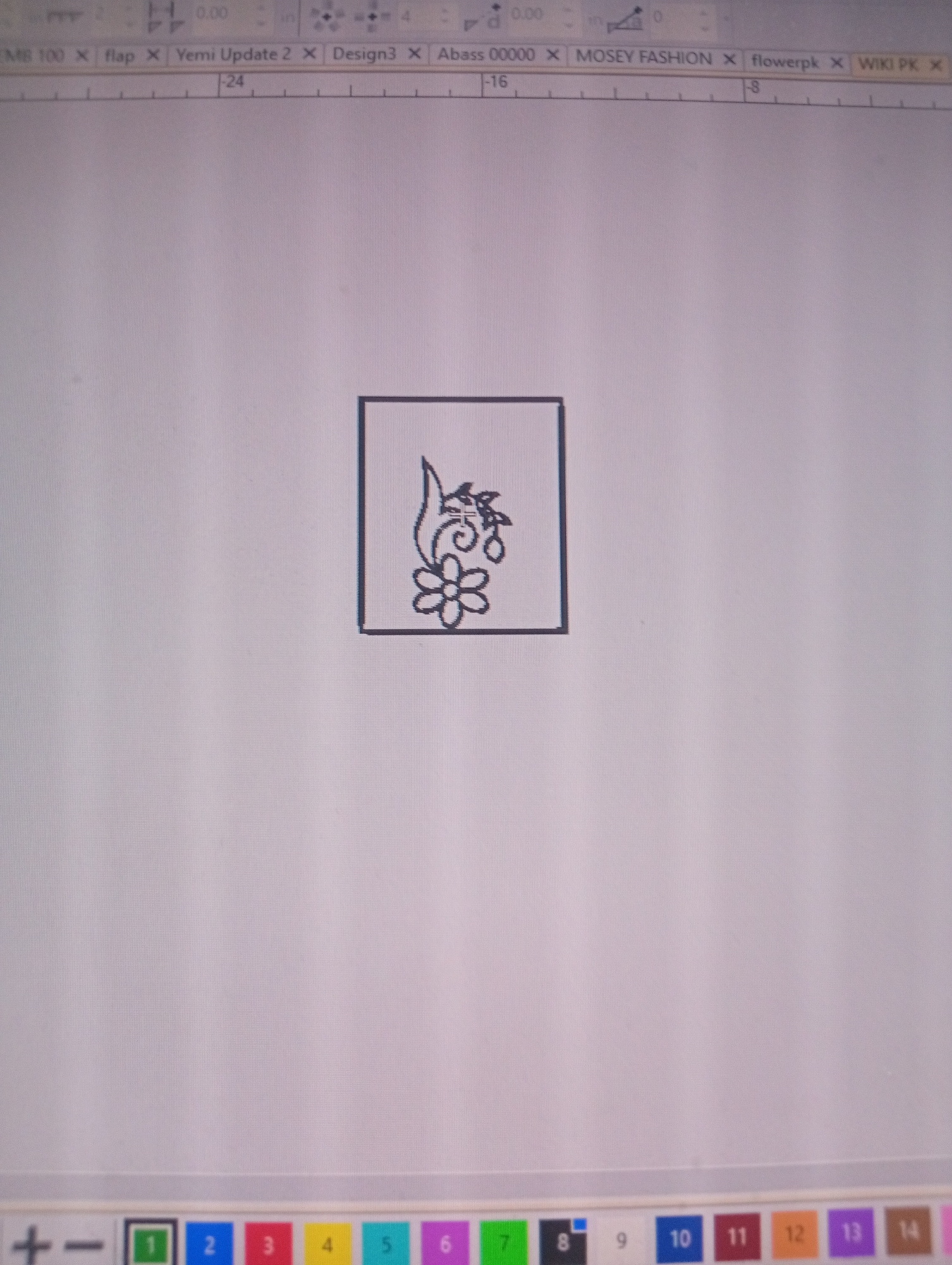 The image displays a screenshot of a computer program, likely a design or editing application, with a simple graphic centered on the screen. The graphic is a black outline of a stylized flower with leaves and berries, enclosed within a square border. The computer's user interface elements are visible at the top and bottom of the image. At the top, there are tabs labeled with text such as "EMB 100," "flap," "Yemi Update 2," "Design3," "Abass 00000," "MOSEY FASHION," "flowerpk," and "WIKI PK." There are also numerical indicators "-24", "-16", and "-8" along a ruler-like bar. At the bottom, there are icons for zoom controls ("+" and "-") and a row of numbered color swatches from "1" to "14".
The image does not contain any information or visual cues that would place it in Rumuepirikom, Nigeria, or any specific city. The content is purely digital and relates to a computer-generated graphic and user interface.