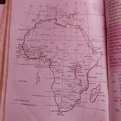 The image is a map of Africa, showing countries, capital cities, and geographical features like the Strait of Gibraltar, Mediterranean Sea, Tropic of Cancer, Equator, Tropic of Capricorn, Red Sea, Atlantic Ocean, and Indian Ocean. The map also indicates the Greenwich Meridian. A legend at the bottom left clarifies that a black dot represents a capital city and dashed lines represent international boundaries.
The city of Jalingo, Nigeria, is not depicted on this map of Africa.