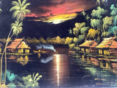 The image depicts a nighttime scene of houses on stilts lining a body of water, likely a river or lake. The houses have thatched roofs and are illuminated with a warm light, reflected in the water. A small boat with a figure is on the water, emitting smoke. Palm trees and other vegetation flank the houses. A vibrant sunset or sunrise is visible in the background, casting a colorful glow across the sky. The style of the image suggests it may be a painting or a print. The city location of Tinaquillo, Venezuela is not evident in the image itself.