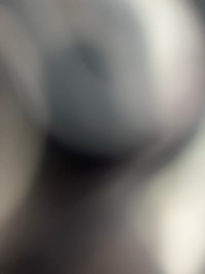 This is a very blurry, abstract image dominated by shades of gray and white. There are no discernible subjects like people, objects, or a clear scene. The lighting appears to be bright and diffused, creating soft gradients and highlights, particularly in the upper right portion of the image. There's a sense of depth suggested by the way the light falls and the varying shades of gray, but the lack of focus makes it impossible to identify any specific shapes or forms. It's unclear if any activity or event is taking place. There is no visible text, time of day, weather cues, or location indicators. The overall impression is one of an out-of-focus photograph of an indoor environment, possibly with some reflective surfaces, but nothing concrete can be identified. The context of Belgrade, Serbia does not provide any visual clues within the image itself.