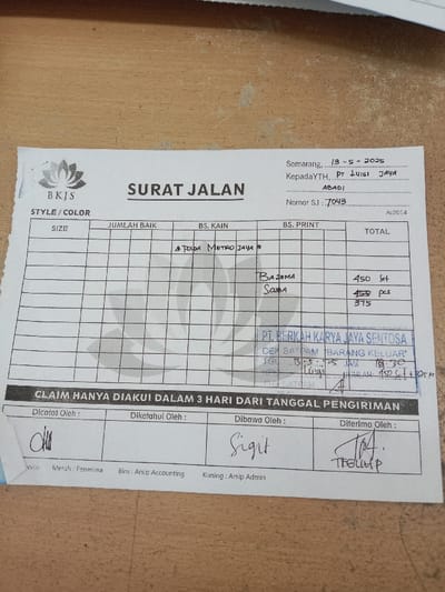 The image shows a document titled "Surat Jalan" (Waybill) from a company called "BKJS" in Semarang, Indonesia. The document is dated 13-5-2025 and addressed to PT Luig Jaya Abadi. The document number is SJ. 7043. The document is a waybill for the delivery of goods.  It lists a variety of fabric styles, sizes, quantities and the total cost for each item. The waybill lists 450 "set" of "Bazima" fabric and 450 "pcs" of "Scuba" fabric. The total cost for both is 375. The document includes a signature from the "Dicatat Oleh" (Recorded By), "Diketdhui Oleh" (Approved By), "Dibawa Oleh" (Delivered By), and "Diterima Oleh" (Received By).  The image was taken in the city of Kecamatan Ngaliyan, Indonesia, which is located at the coordinates -7.01 latitude and 110.364 longitude.