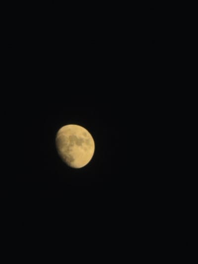 This media file is a photograph of the moon in the night sky. The moon is partially illuminated, showing a crescent shape with visible craters and surface details. The background is a deep black, indicating nighttime. There are no people, text, or specific location cues visible in the image, other than the provided context of Torrevieja, Spain, which suggests the photograph was taken there. The overall mood is serene and captures a moment of observing the celestial body.