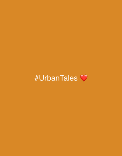 The image is a solid orange background with the text "#UrbanTales" in white letters in the center. To the right of the text, there is a red heart emoji. The image does not depict any identifiable location in South Quy Nhon Ward, Vietnam, nor does it contain any people, subjects, objects, actions, or interactions.