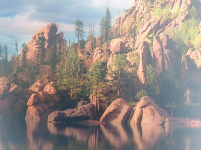 This media file depicts a serene natural landscape. The primary subjects are towering rock formations and a body of water, likely a lake, in the foreground. The rocks are a dominant feature, characterized by their rough, textured surfaces and varying shades of reddish-brown, suggesting they are ancient and weathered. They are interspersed with clusters of trees, primarily coniferous and deciduous species, adding touches of green and yellow-brown to the scene. The water in the foreground is calm and reflective, mirroring the rocks and trees above, creating a sense of depth and tranquility. The sky above is a mix of blue and soft white clouds, hinting at a fair weather day.
The scene appears to be set in a mountainous or hilly region. The scale of the rock formations suggests a natural, undeveloped area. There are no people or explicit objects visible, emphasizing the untouched beauty of the environment. The activity taking place is simply the natural existence of the landscape, with no human intervention or dynamic events apparent.
Notable details include the lighting, which suggests it might be late afternoon or early morning, given the warm tones on the rocks and the soft illumination. The weather appears clear and pleasant, contributing to the peaceful atmosphere. While specific location cues are not immediately obvious, the combination of rock formations, vegetation, and water is characteristic of many natural parklands or wilderness areas. The overall emotion evoked by the image is one of peace, awe, and natural grandeur. No text is visible in the image.