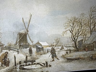 This image depicts a winter landscape scene, presented as being located in the city of Reus, Spain, characterized by overcast skies, widespread snow cover, and ice on a body of water.

In the left foreground, a man in a brown coat and hat stands with a small child, who is also bundled in a coat. They are positioned on the snowy ground adjacent to the frozen water. Behind them, a wooden fence separates them from a large, brown windmill with four prominent sails, one of which is partially obscured. The windmill stands on a raised mound, with a small building at its base.

In the middle ground, on the frozen surface, a figure on ice skates is captured mid-motion, leaning forward and holding a long pole for balance. To the left of this skater, another individual stands upright on the snowy bank, wearing a hat and coat. Further back on the ice, another figure appears to be stooping or engaged in an activity.

On the far right, a woman in a long dress and head covering stands near a small, thatched-roof house or hut. Several bare, deciduous trees, indicative of winter, are prominent on the right side, their branches reaching towards the sky. Additional small structures with thatched roofs are visible throughout the background.

The frozen body of water in the foreground features several dark wooden posts protruding from the ice and a small, partially submerged boat or structure. Patches of dried reeds or grass are visible along the banks and protruding through the snow in various areas. The overall palette is muted, dominated by whites, grays, and browns, with subtle hints of color in the figures' clothing and structures. The texture of the image suggests an aged print or drawing.