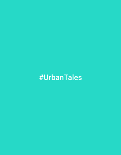 The image is a plain cyan background with white text centered on it. The text reads "#UrbanTales". There are no people, objects, or discernible scene elements. The activity or event is not identifiable. There are no notable details regarding time of day, weather, or location cues. The emotion conveyed is neutral.