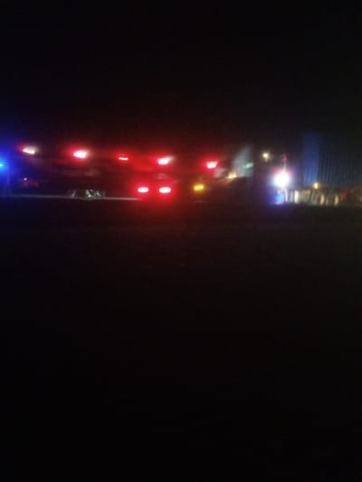 The image depicts a nighttime scene with multiple vehicles visible, characterized by their illuminated headlights and taillights. The lighting suggests an urban environment, possibly a street or a parking area. The overall quality of the image is low, with blurriness and graininess, making precise identification of details difficult. No specific landmarks or identifying features of Nassarawa, Nigeria, are discernible. The scene appears to be static, with no obvious actions or interactions taking place. The darkness dominates the frame, with the lights of the vehicles providing the primary visual information.