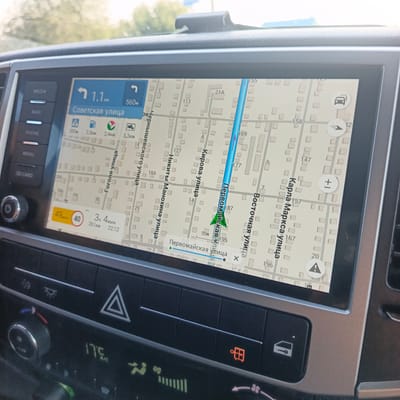 The image shows a car's infotainment system displaying a navigation map. The map shows streets with building outlines and street names in Russian. The current location is indicated by a blue arrow, and a route is highlighted in blue. The system displays the current speed as 49 km/h, with a speed limit of 40 km/h shown in a red circle. It also shows the estimated time of arrival (4 hours and 4 minutes) and distance (261 km) remaining, along with the current time (22:12).

The car's climate control panel is visible below the infotainment screen. It features temperature display showing 17.5°C, various climate control buttons, and a hazard light button.

Based on the street names visible on the map, such as "Советская улица" (Sovetskaya Street), "Первомайская улица" (Pervomayskaya Street), "Кирова улица" (Kirova Street), "Никиты Махонина улица" (Nikity Makhonina Street), "Чернышевского улица" (Chernyshevskogo Street), "Гоголя улица" (Gogolya Street), "Восточная улица" (Vostochnaya Street), and "Карла Маркса улица" (Karl Marx Street), this scene is likely in the city of Kambarka, Russia, as these are prominent street names in that city. The presence of Cyrillic script on the map further confirms a Russian context.